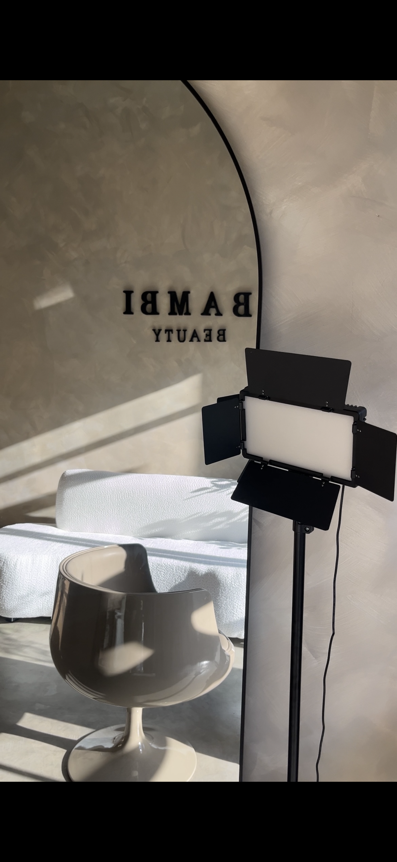 Bambï Beauty studio space with mirror and styling light